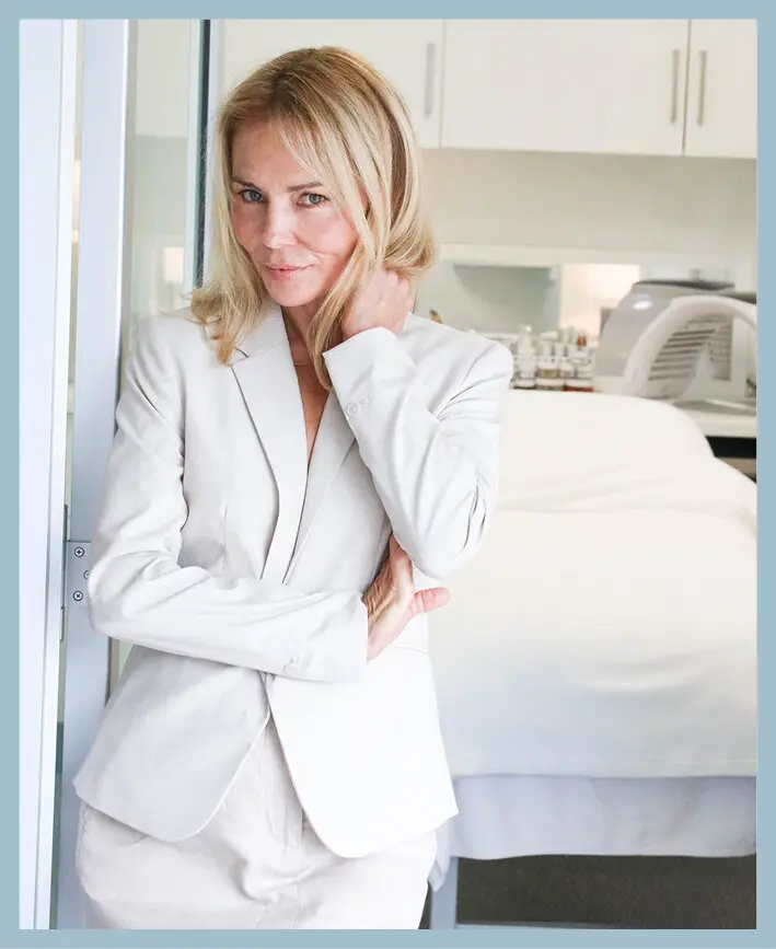 Asea Healing Tao Australia. Ingrid Seaburn wearing a white jacket and pants inside a skincare medical clinic
