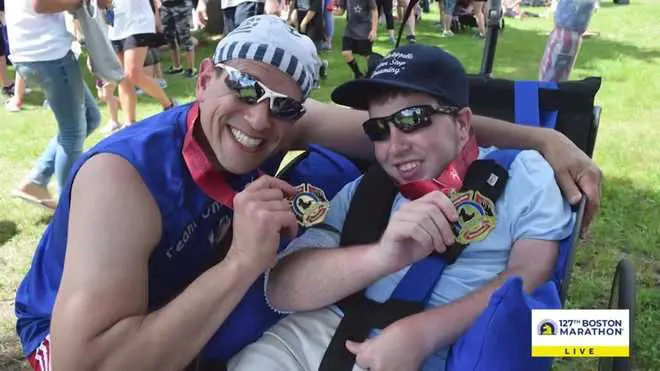 Asea Healing Tao Australia. Michael and Kyle Didonato smiling and holding their gold medals after winning a triathlon